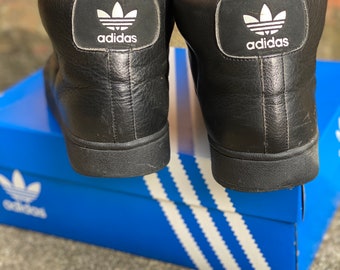 all black high top shell toes