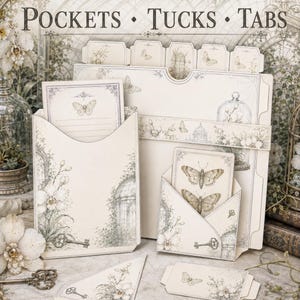 May include: A stationery set featuring cream-colored paper pockets, tucks, and tabs with vintage-style botanical and butterfly illustrations. The items include envelopes, cards, and folders decorated with floral motifs, keys, and cages, with the text POCKETS &bull; TUCKS &bull; TABS printed at the top.