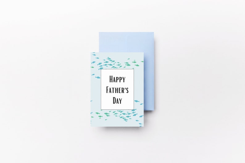 May include: A light blue card with a school of blue and green fish printed on it. The card has a white rectangle with the text "Happy Father's Day" inside.