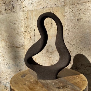 Black abstract ceramic sculpture one