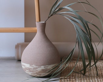 Brown vase with beige streaks