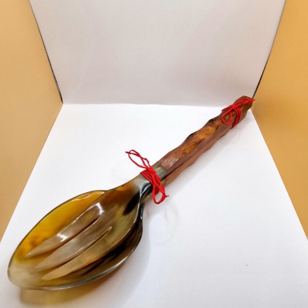 Enhance your culinary experience with handcrafted salad servers made from precious wood and zebu horn - uniquely crafted elegance!