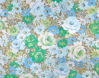 Wallpaper Flowers fabric uses greens and whites to make an amazing vintage floral design.