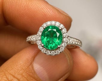 Emerald Halo Ring: Oval Green Gemstone, Sterling Silver & CZ
