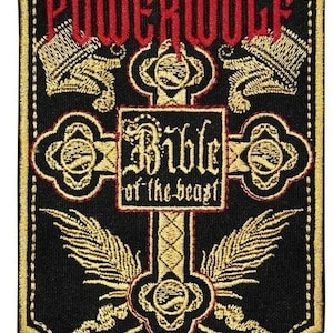 May include: A black embroidered patch with gold and red stitching. The patch features a cross with the words "Bible of the Beast" and the band name "POWERWOLF" at the top.