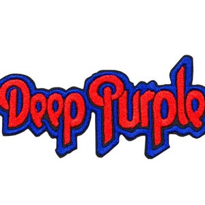 May include: An embroidered fabric patch featuring the text Deep Purple in a stylized red font with a thick blue border. The lettering is connected in a continuous script-like design with a black outline surrounding the entire blue border.