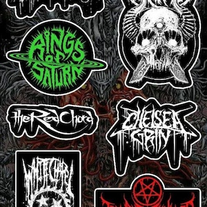 May include: A collection of black and white band logo stickers, including "All Shall Perish," "Carnifex," "Rings of Saturn," "The Red Chord," "Chelsea Grin," "Whitechapel," and "Thy Art Is Murder." The stickers feature gothic fonts and imagery.