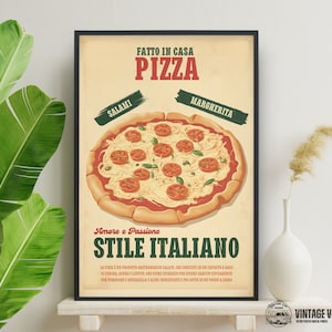 May include: A framed vintage-style pizza poster. The poster features a detailed illustration of a pizza with tomato slices and cheese. Text includes "FATTO IN CASA PIZZA", "SALAMI", "MARGHERITA", and "STILE ITALIANO". The poster has a cream-colored background.
