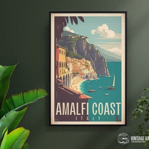 May include: A vintage travel poster featuring a colorful illustration of the Amalfi Coast in Italy. The poster has a blue, green, and white color scheme and features a view of the coastline with buildings, boats, and a beach.