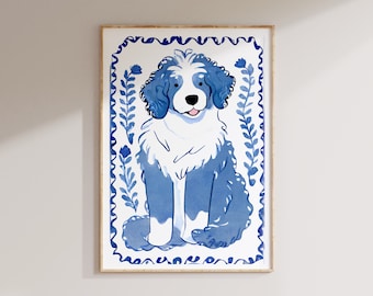 May include: A blue and white illustration of a dog sitting in a decorative frame. The dog has a white chest and a blue body with a white face. The frame is decorated with blue and white floral designs.
