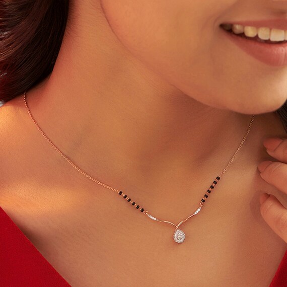 Caratlane black 2024 beads chain