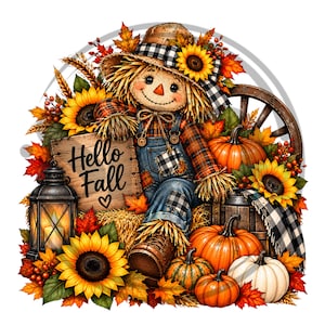 Może przedstawiać: Strach na wróble w koszuli w kratę i dżinsowych ogrodniczkach siedzi na sianie, trzymając drewnianą tabliczkę z napisem Hello Fall i sercem. Scena zawiera słoneczniki, pomarańczowe i białe dynie, latarnię oraz jesienne liście w odcieniach czerwieni i złota.
