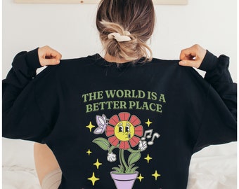 May include: Black sweatshirt with a graphic of a smiling flower in a pot with the text "The world is a better place with you in it".