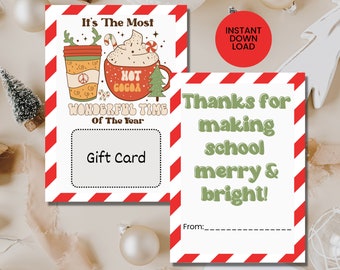 Peut inclure: Une carte cadeau imprimable avec une bordure rayée rouge et blanche. La carte présente une illustration de dessin animé d'une tasse de chocolat chaud avec de la crème fouettée et une canne en sucre. Le texte sur la carte dit "C'est le moment le plus merveilleux de l'année" et "Carte cadeau". La carte comprend également un espace pour un message et une signature. La carte est parfaite pour les enseignants, les amis ou la famille.