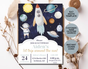 May include: A blue and white 5x7 inch printable invitation template for a space-themed birthday party. The invitation features a rocket, astronaut, planets, and stars. The text on the invitation reads "Please join us to celebrate Aiden's 1st trip around the sun!" with the date, time, and location of the party.