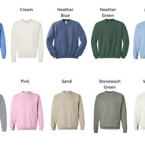 May include: A set of 10 crew neck sweatshirts in various colors, including Carolina blue, cream, heather blue, heather green, light blue, light gray, pink, sand, stonewash green, and white.