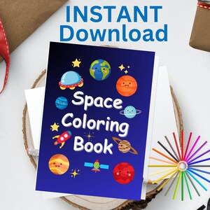 May include: A "Space Coloring Book" with a blue cover featuring cartoon planets, stars, and a rocket. The words "Space Coloring Book" are in white. The words "INSTANT Download" are at the top. A pencil and colored pencils are also visible.