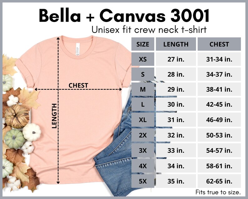 May include: A peach-colored unisex t-shirt with a crew neck and short sleeves. The t-shirt is laid flat on a white surface with a pair of blue jeans and fall leaves. A size chart is shown with measurements in inches for chest and length.