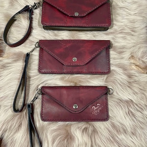 Women&#39;s leather clutch wallet with strap