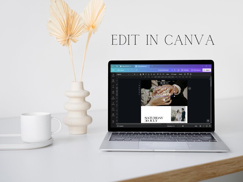 May include: A laptop computer displaying a Canva design template for a wedding invitation. The design features a photo of a couple's hands with a wedding ring, and the text "FOREVER & ALWAYS" and "SATURDAY 30 JULY".