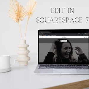 May include: A laptop showing a website with a person smiling on the screen. A white mug on a white coaster, a decorative vase, and dried palm leaves are beside the laptop. The text "EDIT IN SQUARESPACE 7.1" is at the top.