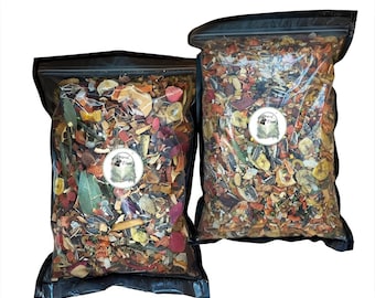May include: Two clear plastic bags filled with a colorful mix of dried fruits, vegetables, seeds, and herbs. Each bag has a black zipper closure and a circular label with an owl illustration and the text "Animal Island". The contents are visible.