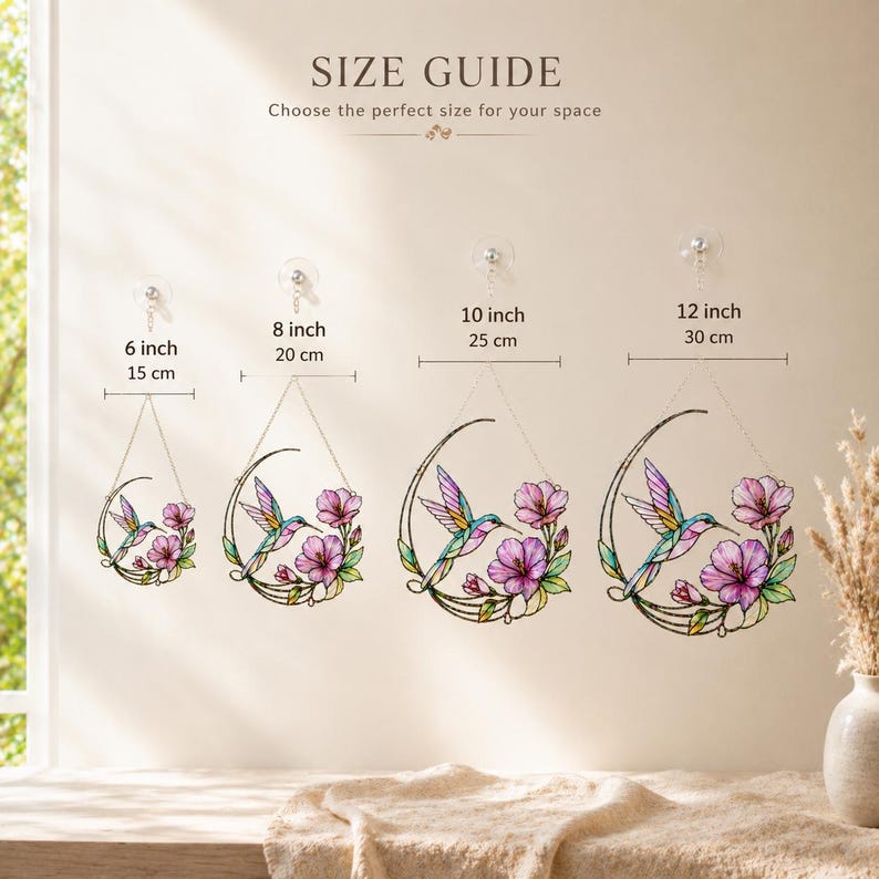 May include: A size guide graphic displaying four stained glass hummingbird and flower suncatchers in crescent moon frames. Sizes labeled are 6 inch, 8 inch, 10 inch, and 12 inch. Each piece features a colorful hummingbird and pink flowers.