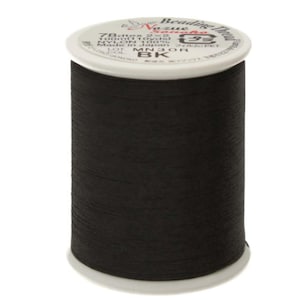 May include: A spool of black beading thread with a white label on top. The label reads Nozue Sonoko Beading Thread, 78dtex 2x2, 100m (110yds), 100% Nylon, Made in Japan, and BK. The thread is tightly wound around the cylindrical plastic spool.