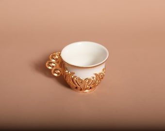 Turkish coffee cups, made of porcelain, with many colores, decoreted with silver, golden metal color.
