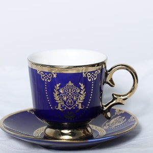 luxury set of turkish arabic coffee cups, colored by dark blue, decotared with pretty gold, made of porcelain