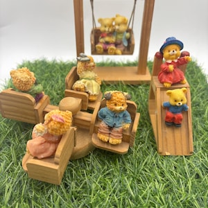 Lot of  beautiful resine  miniature  bear figures on wood  at the park. Vintage miniature bears. Unique deco.