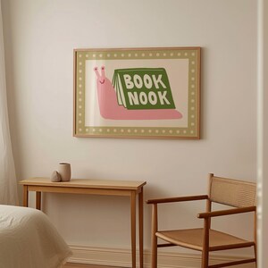 Playful pink book snail illustration with Book Nook text. Contemporary maximalist art print featuring retro-inspired design. Funky bookish wall decor, groovy library art, bibliophile gift print