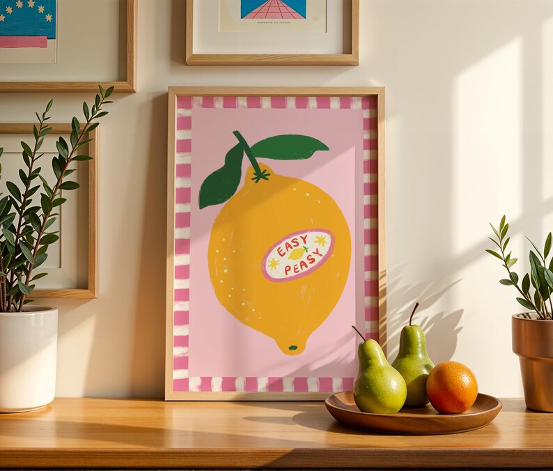 Cheerful hand drawn lemon illustration with playful easy peasy typography, bright yellow citrus fruit wall art in dopamine art style, modern kitchen print with quirky lettering and fun fruit doodles, maximalist summer decor featuring bold colors and happy vibes, trendy food art perfect for kitchen gallery wall, retro inspired fruit illustration with positive message, funky home decor with fresh citrus theme