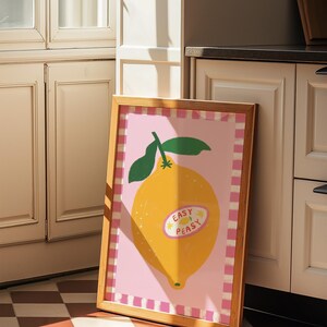 Cheerful hand drawn lemon illustration with playful easy peasy typography, bright yellow citrus fruit wall art in dopamine art style, modern kitchen print with quirky lettering and fun fruit doodles, maximalist summer decor featuring bold colors and happy vibes, trendy food art perfect for kitchen gallery wall, retro inspired fruit illustration with positive message, funky home decor with fresh citrus theme