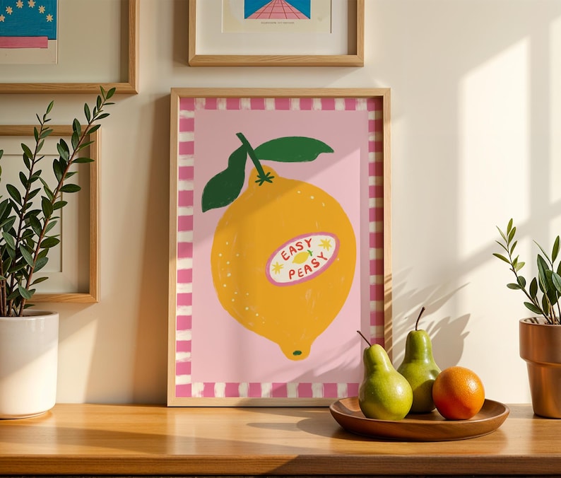Cheerful hand drawn lemon illustration with playful easy peasy typography, bright yellow citrus fruit wall art in dopamine art style, modern kitchen print with quirky lettering and fun fruit doodles, maximalist summer decor featuring bold colors and happy vibes, trendy food art perfect for kitchen gallery wall, retro inspired fruit illustration with positive message, funky home decor with fresh citrus theme