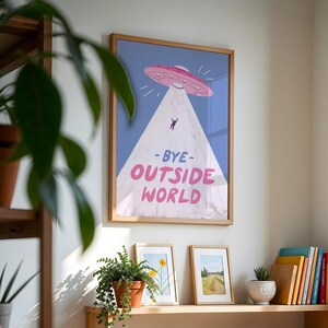 Playful blue illustration of UFO spaceship with light beam abducting stick figure. Text reads bye outside world. Perfect for homebody introvert space lovers funny modern minimalist wall decor cozy room art