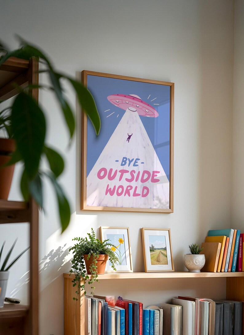 Playful blue illustration of UFO spaceship with light beam abducting stick figure. Text reads bye outside world. Perfect for homebody introvert space lovers funny modern minimalist wall decor cozy room art