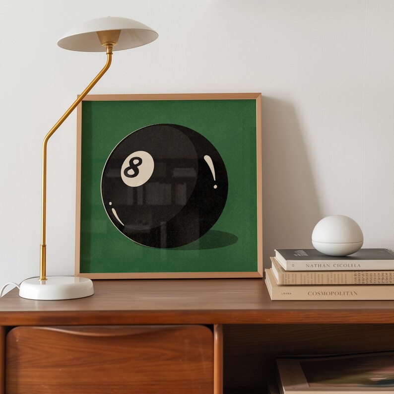 Retro-styled illustration featuring the iconic eight ball from billiards, designed with vintage appeal and classic gaming nostalgia. Art print perfectly suited for pool rooms, man caves, game rooms, sports bars, or den areas. Traditional billiards memorabilia inspired artwork with timeless appeal for vintage sports decor enthusiasts.