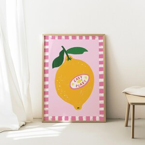 Cheerful hand drawn lemon illustration with playful easy peasy typography, bright yellow citrus fruit wall art in dopamine art style, modern kitchen print with quirky lettering and fun fruit doodles, maximalist summer decor featuring bold colors and happy vibes, trendy food art perfect for kitchen gallery wall, retro inspired fruit illustration with positive message, funky home decor with fresh citrus theme