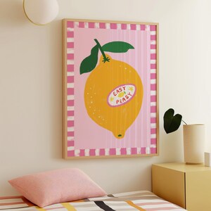 Cheerful hand drawn lemon illustration with playful easy peasy typography, bright yellow citrus fruit wall art in dopamine art style, modern kitchen print with quirky lettering and fun fruit doodles, maximalist summer decor featuring bold colors and happy vibes, trendy food art perfect for kitchen gallery wall, retro inspired fruit illustration with positive message, funky home decor with fresh citrus theme