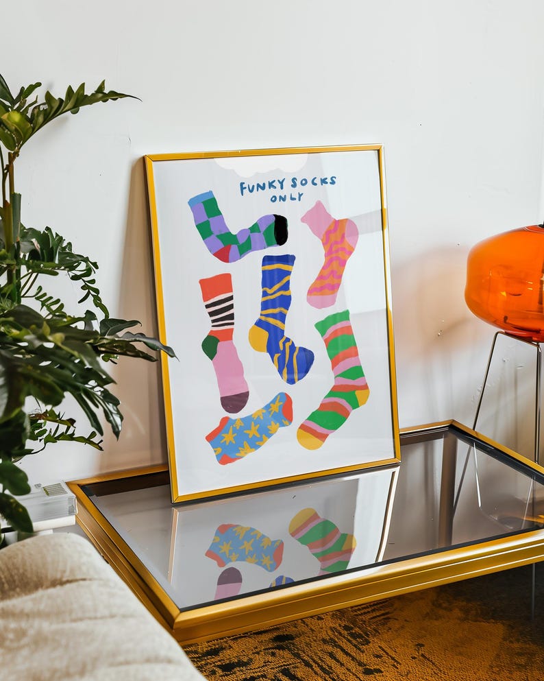 Maximalist illustration featuring a collection of vibrant patterned socks arranged in a playful composition. Perfect for maximalist decor enthusiasts, sock collectors, fashion lovers looking for unique wall art. Ideal decoration for laundry rooms, mudrooms, walk in closets, teen bedrooms, dorm rooms, or any space needing a pop of personality. Hand drawn illustration with dopamine color palette and retro inspired patterns brings quirky character to contemporary interiors.