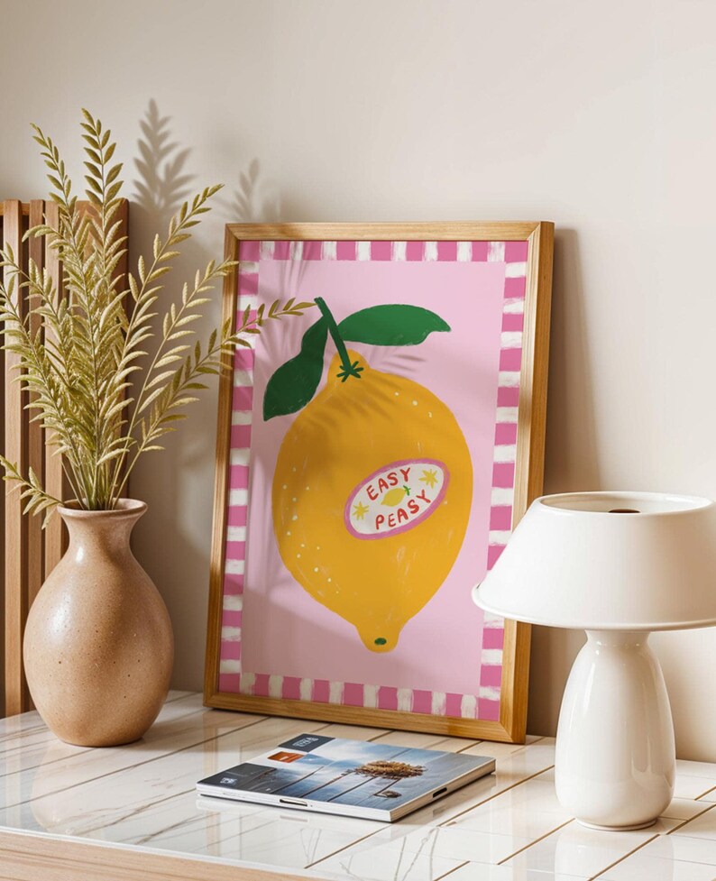 Cheerful hand drawn lemon illustration with playful easy peasy typography, bright yellow citrus fruit wall art in dopamine art style, modern kitchen print with quirky lettering and fun fruit doodles, maximalist summer decor featuring bold colors and happy vibes, trendy food art perfect for kitchen gallery wall, retro inspired fruit illustration with positive message, funky home decor with fresh citrus theme