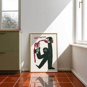 Illustration of a cute character pouring wine into a glass, wine overflowing, with hand lettered text saying when in fun typography. Perfect as kitchen wall art decoration, funny bar room decor, wine cellar artwork. Quirky illustration style with modern aesthetic, hand drawn wine art for home bar. Makes great housewarming present, wine enthusiast present, birthday gift for best friend who loves wine. Funky wine themed home decor that brings personality to kitchen, dining room, or wine room.