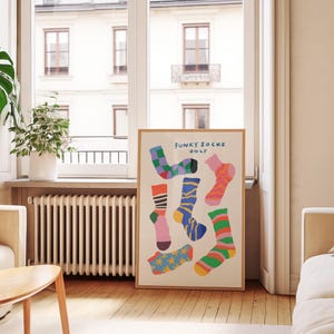 Maximalist illustration featuring a collection of vibrant patterned socks arranged in a playful composition. Perfect for maximalist decor enthusiasts, sock collectors, fashion lovers looking for unique wall art. Ideal decoration for laundry rooms, mudrooms, walk in closets, teen bedrooms, dorm rooms, or any space needing a pop of personality. Hand drawn illustration with dopamine color palette and retro inspired patterns brings quirky character to contemporary interiors.