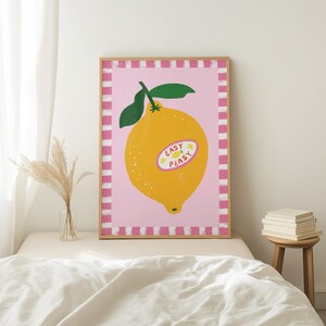 Cheerful hand drawn lemon illustration with playful easy peasy typography, bright yellow citrus fruit wall art in dopamine art style, modern kitchen print with quirky lettering and fun fruit doodles, maximalist summer decor featuring bold colors and happy vibes, trendy food art perfect for kitchen gallery wall, retro inspired fruit illustration with positive message, funky home decor with fresh citrus theme