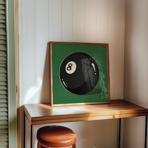 Retro-styled illustration featuring the iconic eight ball from billiards, designed with vintage appeal and classic gaming nostalgia. Art print perfectly suited for pool rooms, man caves, game rooms, sports bars, or den areas. Traditional billiards memorabilia inspired artwork with timeless appeal for vintage sports decor enthusiasts.