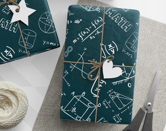 May include: Three green gift boxes wrapped in paper with a white math-themed pattern. The boxes are tied with twine and have white paper tags attached. The boxes are on a white and gray chevron patterned surface.