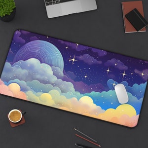 May include: A purple, blue, and yellow mouse pad with a starry night sky and clouds design. The mouse pad has a black border and a white mouse is on the pad.