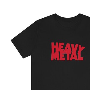 May include: Black t-shirt with a red "Heavy Metal" graphic printed on the front.