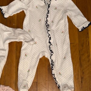 May include: A set of three ceramic mugs with a speckled, matte finish. The mugs are in shades of cream, light gray, and dark gray. Each mug has a simple, minimalist design, perfect for coffee or tea.